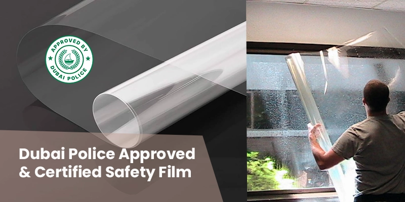 Dubai Police certified safety film installation on glass window.