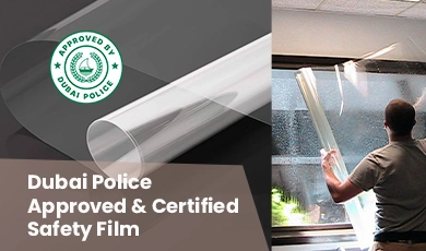 Dubai Police certified safety film installation on glass window.